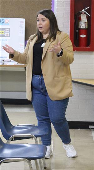 Presenter talking to students